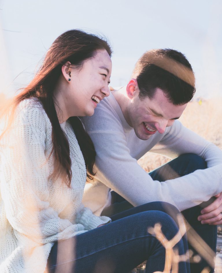 A couple laughing together